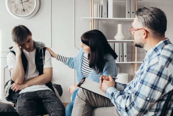 adult man talking with the adult persons